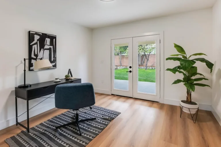Staged home office with a black desk